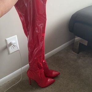 Brand new red faux patent thigh high boots.